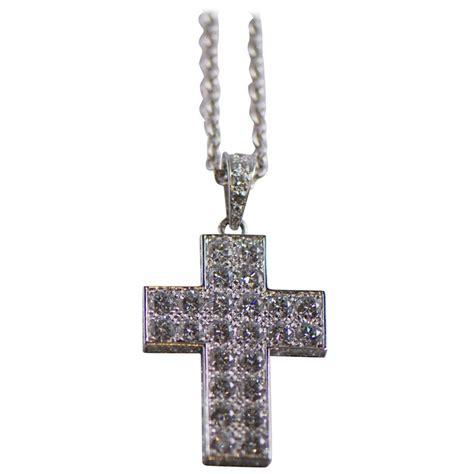 cartier diamond cross necklace.